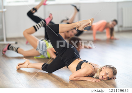 Group of women in high heels dances on floor 121139683