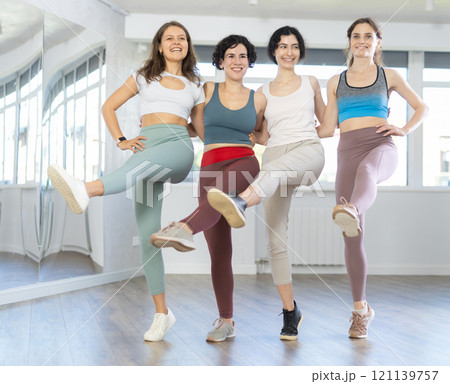 Group of girls with middle-aged woman perform Irish folk dance Group of girls with middle-aged woman perform Irish folk dance 121139757