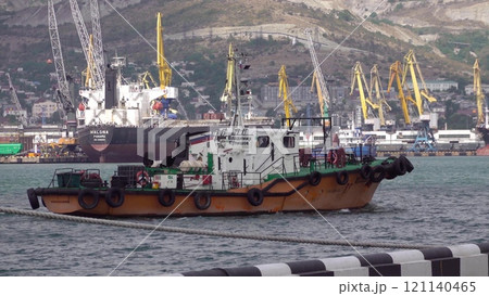 Novorossiysk, Russia - 18 August 2023. red port ship name Vladimir Kulishov in the port of Novorossiysk Black Sea 121140465