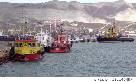 Novorossiysk, Russia - 18 August 2023. red port ship name Locman 3 in the port of Novorossiysk Black Sea Novorossiysk, Russia - 18 August 2023. red port ship name Locman 3 in the port of Novorossiysk Black Sea 121140497