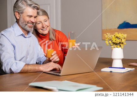 Happy mature couple at home looking contented and peaceful 121141344