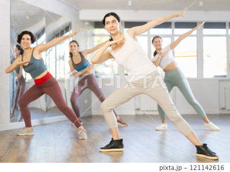 Group of women dancing hip hop in studio 121142616
