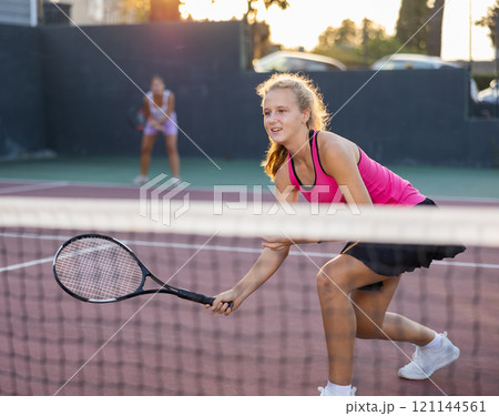 Active tennis girl in court ready for play and train Active tennis girl in court ready for play and train 121144561