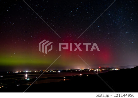 The Aurora Borealis, the northern lights, showing up above Maghery, Burtonport, Arranmore and Dungloe in County Donegal, Ireland. 121144956