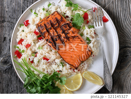 grilled red salmon fillet with rice, top view grilled red salmon fillet with rice, top view 121145327