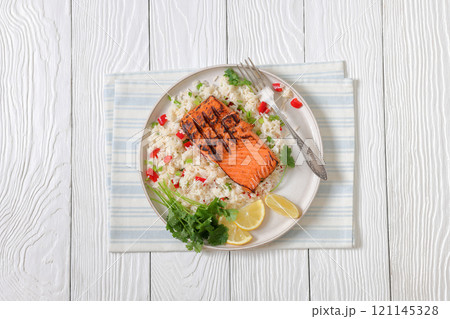 grilled red salmon fillet with rice, top view grilled red salmon fillet with rice, top view 121145328