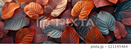Stylized autumn leaves with intricate patterns and vibrant colors on a textured, neutral background. 121145464