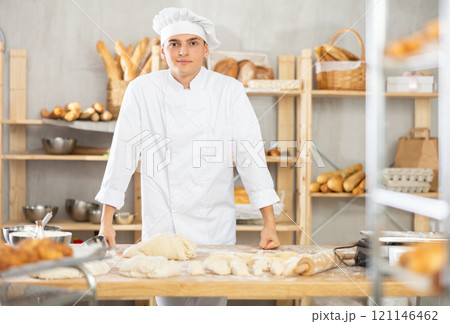 Young guy standing in bakehouse, ready to start baking 121146462
