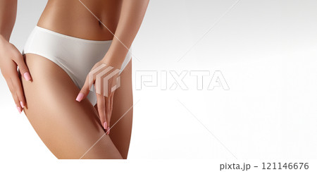 Spa, wellness. Healthy slim body. Beautiful sexy hips. Fitness or plastic surgery. Perfect buttocks without cellulite 121146676