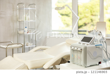 Aesthetic medicine clinic office with a treatment chair and a hydrogen-oxygen cosmetology apparatus Aesthetic medicine clinic office with a treatment chair and a hydrogen-oxygen cosmetology apparatus 121146903