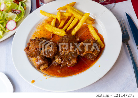 Oxtail in sauce - Rabo de toro. Spanish dish 121147275