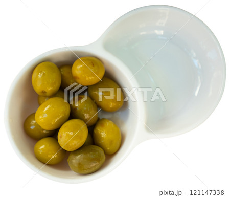 Spanish tapas from marinaded green olives at plate 121147338