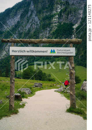 Konigssee Lake in Bavaria Germany with Church by the Lake White Boat Forested Mountain and Beautiful Sunny Trekking in Berchtesgaden German Alps. High quality photo Konigssee Lake in Bavaria Germany with Church by the Lake White Boat Forested Mountain and Beautiful Sunny Trekking in Berchtesgaden German Alps. High quality photo 121148275