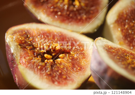 fig on a wooden board on white background,  121148904