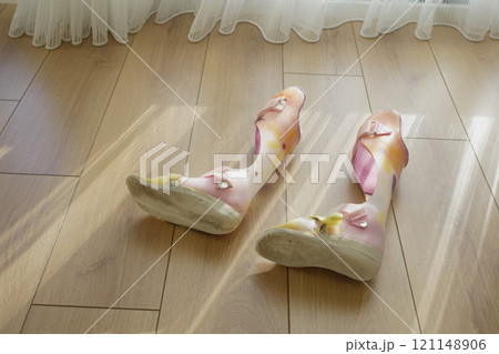 Colorful Child Orthopedic Braces on a wooden floor Colorful Child Orthopedic Braces on a wooden floor 121148906