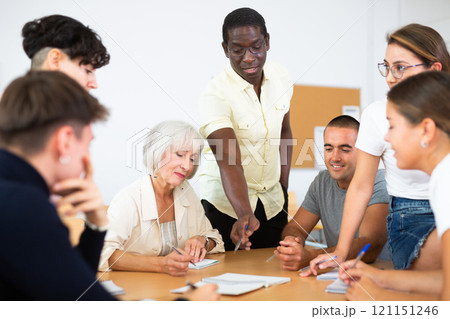 Diverse people on language courses in classroom 121151246