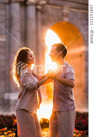 Couple dancing swing at puerta de alcala in madrid at sunset Couple dancing swing at puerta de alcala in madrid at sunset 121151847