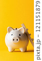 Piggy bank with wooden ladder on vibrant yellow background symbolizes financial growth, AI 121151879