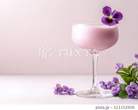 glass of purple color cocktail with violet flowers dcoration 121152056