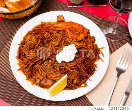 Fideua with seafood served on platter Fideua with seafood served on platter 121152269
