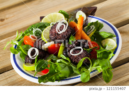 Appetizing black pudding with rice Appetizing black pudding with rice 121155407