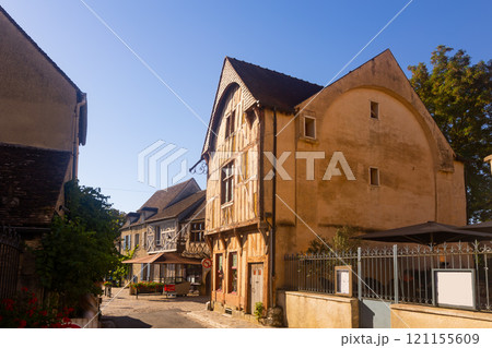 Street in old district of Provins town with wooden timber-framed houses 121155609