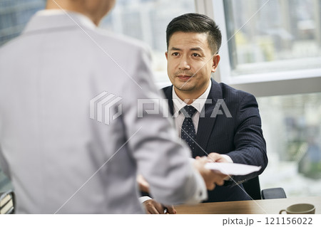 asian business manager working in office 121156022