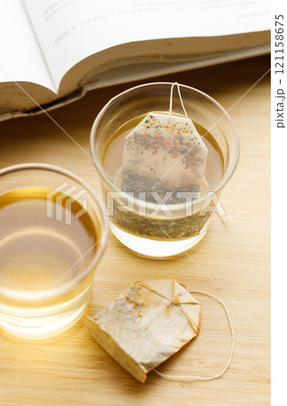 glass of hot tea and tea bag 121158675