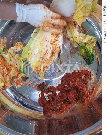 woman hand washing cabbage with cabbage woman hand washing cabbage with cabbage 121163950