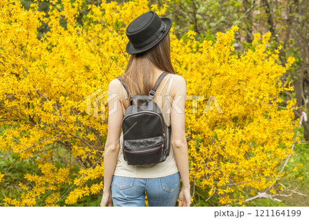 Pretty traveler woman travel in flower garden outdoors 121164199