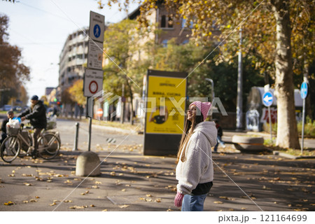 Taking an Urban Stroll in Autumn Embracing Fashion, Leisure, and City Vibes Together 121164699