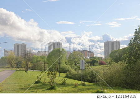 Lush greenery of trees and lawns in the park, urban landscape park. Lush greenery of trees and lawns in the park, urban landscape park. 121164819