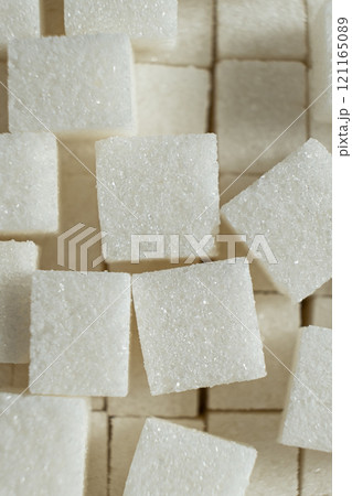 Cubes of white crystalline beetroot refined sugar. Cubes of white crystalline beetroot refined sugar. 121165089