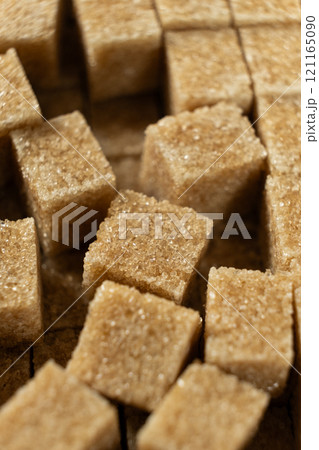 Macro cubes of brown cane unrefined demerara sugar. Macro cubes of brown cane unrefined demerara sugar. 121165090