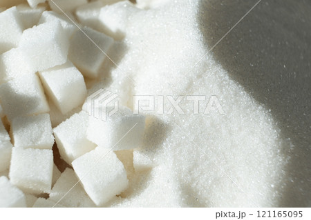 White refined beet sugar in the form of crystals and cubes. 121165095