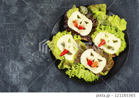 Mini sandwiches with monster faces. 121165365