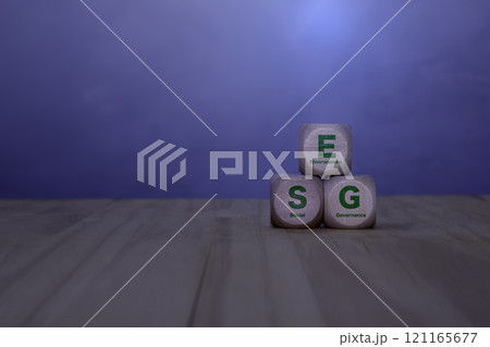 ESG, Renewable energy concept. Icon on wood on green background. ESG icon and Sustainable and renewable green energy icon on wood. Environmental protection. Net zero emissions. Carbon credits. 121165677