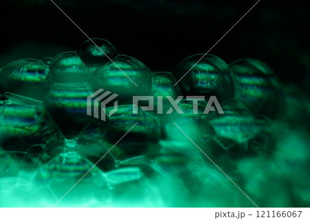 Green liquid phenomenal minimalistic structure, cold green liquid flow on the dark background, colourful abstract, surrealistic art, line of light 121166067