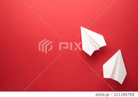 White paper plane on red background, Business competition concept. 121166768