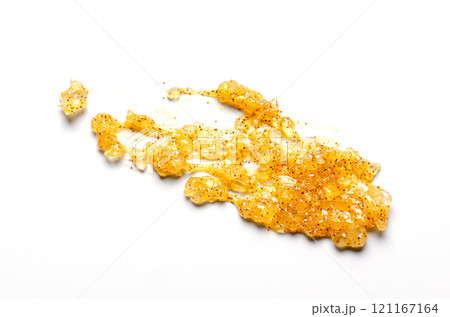 A sample of a cosmetic body care scrub. White background. A sample of a cosmetic body care scrub. White background. 121167164