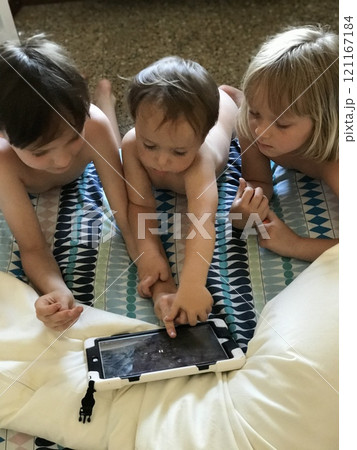 Home, tablet and relax family children watch video, subscription movie or streaming cartoon film, media or web app. Gaming friends, playing online games 121167184