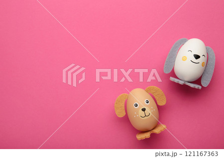 Easter eggs cute bunny and dog on pink background. Funny decoration. Happy Easter Easter eggs cute bunny and dog on pink background. Funny decoration. Happy Easter 121167363