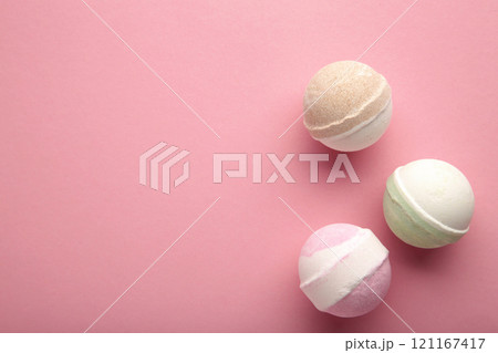 Bath bombs on pink concrete background. Bathroom composition 121167417