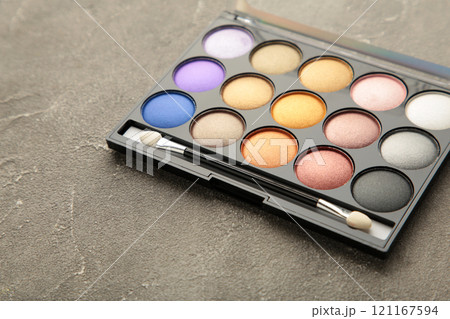 Professional makeup palette with brush on grey background. Make up cosmetics. Professional makeup palette with brush on grey background. Make up cosmetics. 121167594