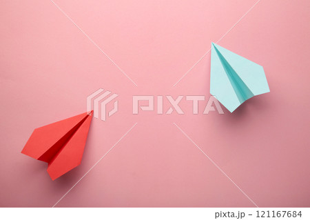 Red and blue paper plane on pink background, Business competition concept. 121167684