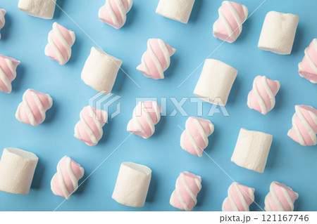 White and pink marshmallow on blue background. Pastel creative textured pattern. minimal White and pink marshmallow on blue background. Pastel creative textured pattern. minimal 121167746