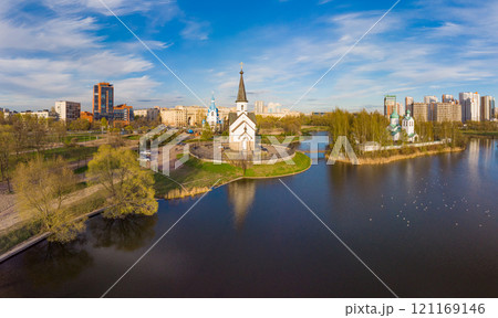 Aerial top View to St. George the Victorious Georgievskaya, Sergius Of Radonezh and Church Nativity of Christ and Srednerogatsky pond. Pulkovsky park. Saint Petersburg. Russia. Europe Aerial top View to St. George the Victorious Georgievskaya, Sergius Of Radonezh and Church Nativity of Christ and Srednerogatsky pond. Pulkovsky park. Saint Petersburg. Russia. Europe 121169146