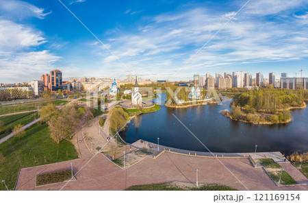 Aerial top View to St. George the Victorious Georgievskaya, Sergius Of Radonezh and Church Nativity of Christ and Srednerogatsky pond. Pulkovsky park. Saint Petersburg. Russia. Europe Aerial top View to St. George the Victorious Georgievskaya, Sergius Of Radonezh and Church Nativity of Christ and Srednerogatsky pond. Pulkovsky park. Saint Petersburg. Russia. Europe 121169154