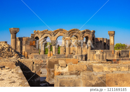 Columns and unique stone ruins of the ancient medieval Zvartnots temple. Vagharshapat Famous landmark constructed in the 7-th century in Armenia. Museum and archaeological site. Yerevan. Europe. 121169185