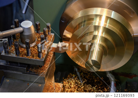 The lathe machine finish cut the brass material parts by lathe tools. The lathe machine finish cut the brass material parts by lathe tools. 121169393